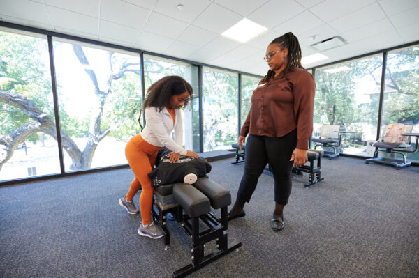 Chiropractic adjustment training during class at Parker University - Dallas, Texas